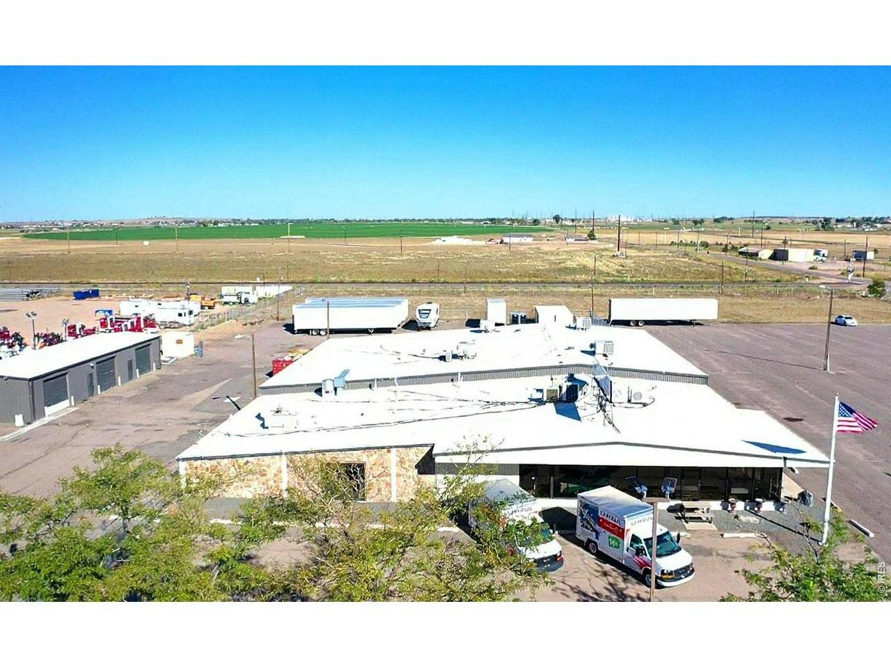 Wide aerial view of the Fort Lupton property and surrounding corridor