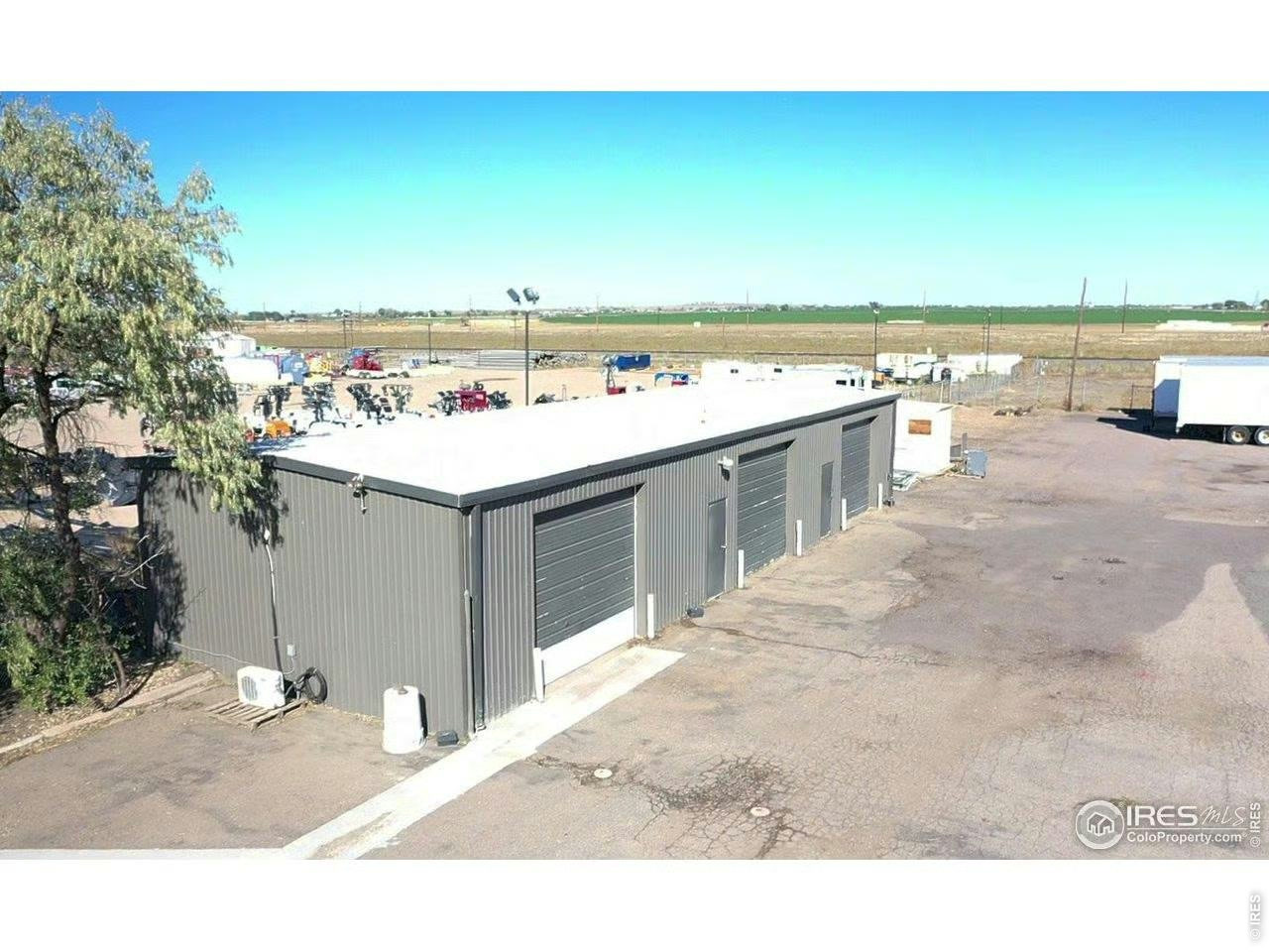 Exterior service building with multiple overhead doors